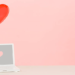 Laptop with a heart balloon